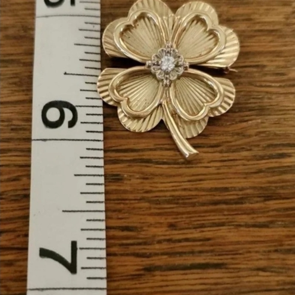 Elegant Gold Clover Brooch with Crystal Center
